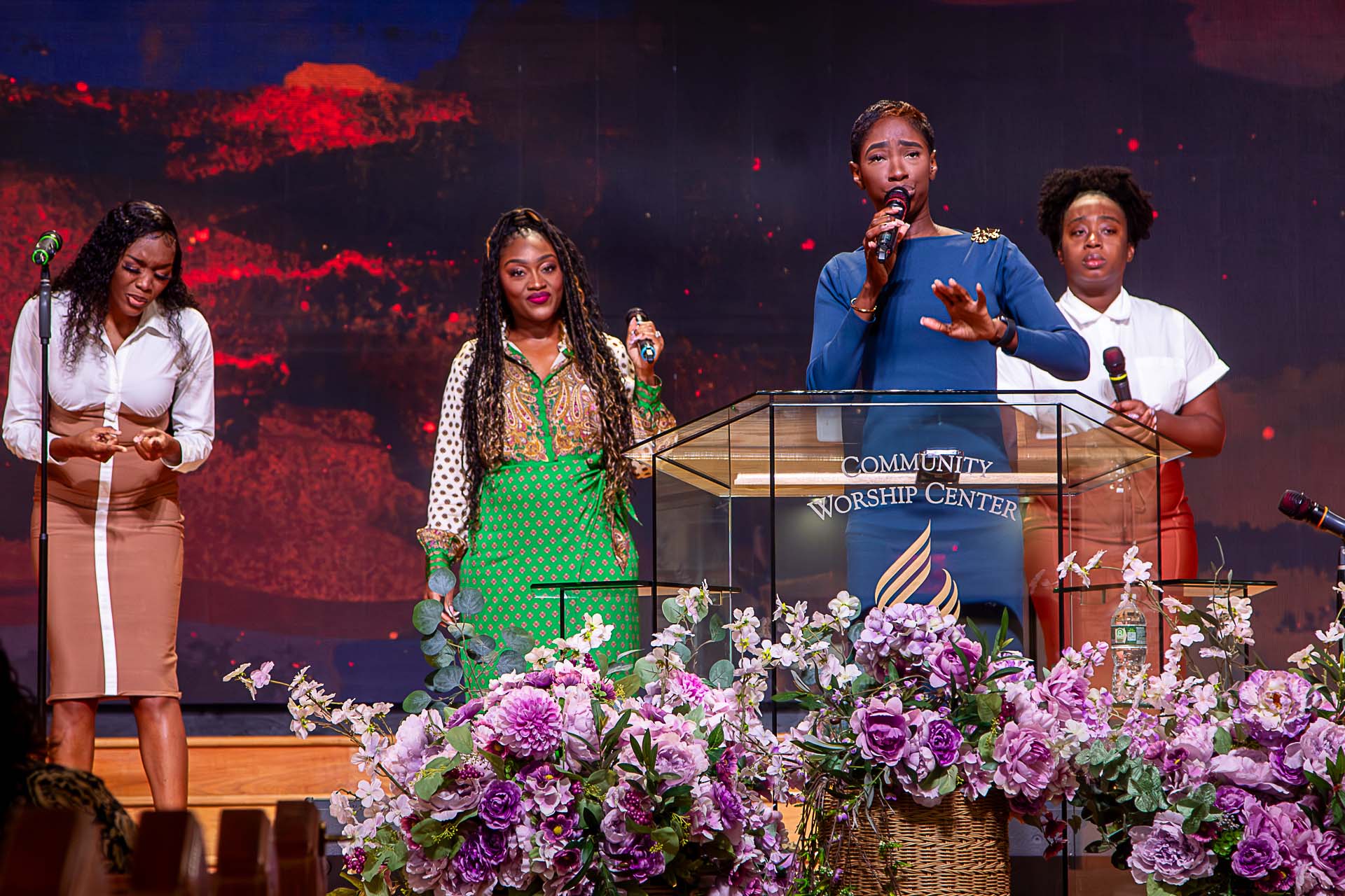 Christian Women Singing dressed beautifully, one leading